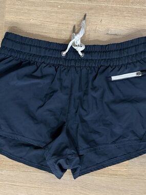 Vuori Clementine Women’s Navy Lined Running Shorts Size S Zip Pocket